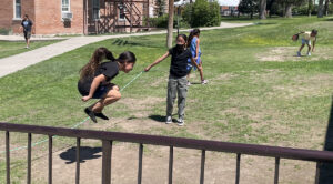Students at the Red Cloud Indian School near Pine Ridge, S.D., play outside during their final day of school in the 2022-23 school year. Students at the school are taught in an environment that highlights indigenous history and cultural values. South Dakota News Watch photo by Bart Pfankuch 