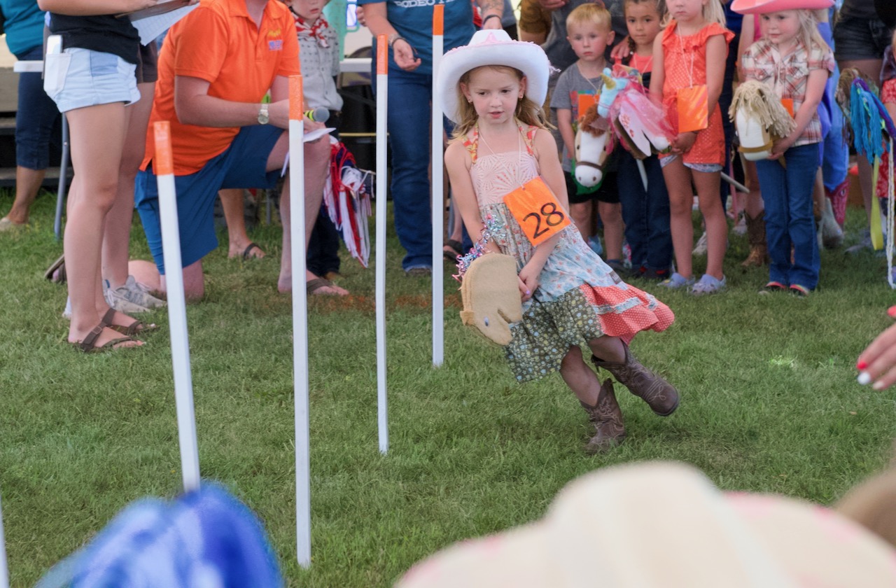 Arya Guthmiller runs through the pole bending event during the Stick Horse Rodeo event on Tuesday, Aug. 15. Aberdeen Insider photo by Elisa Sand
