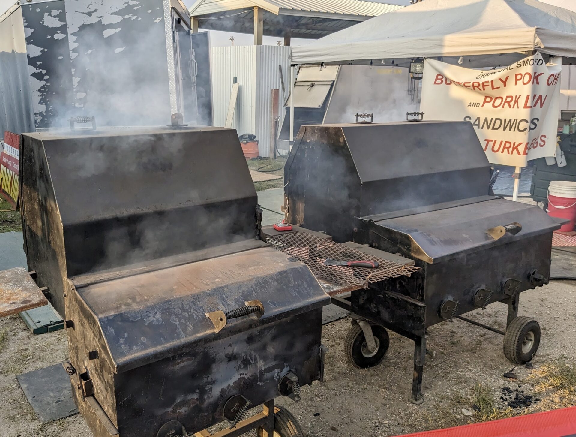 Smokers cook food near the grandstand Wednesday night at the Brown County Fair. Aberdeen Insider photo by Scott Waltman