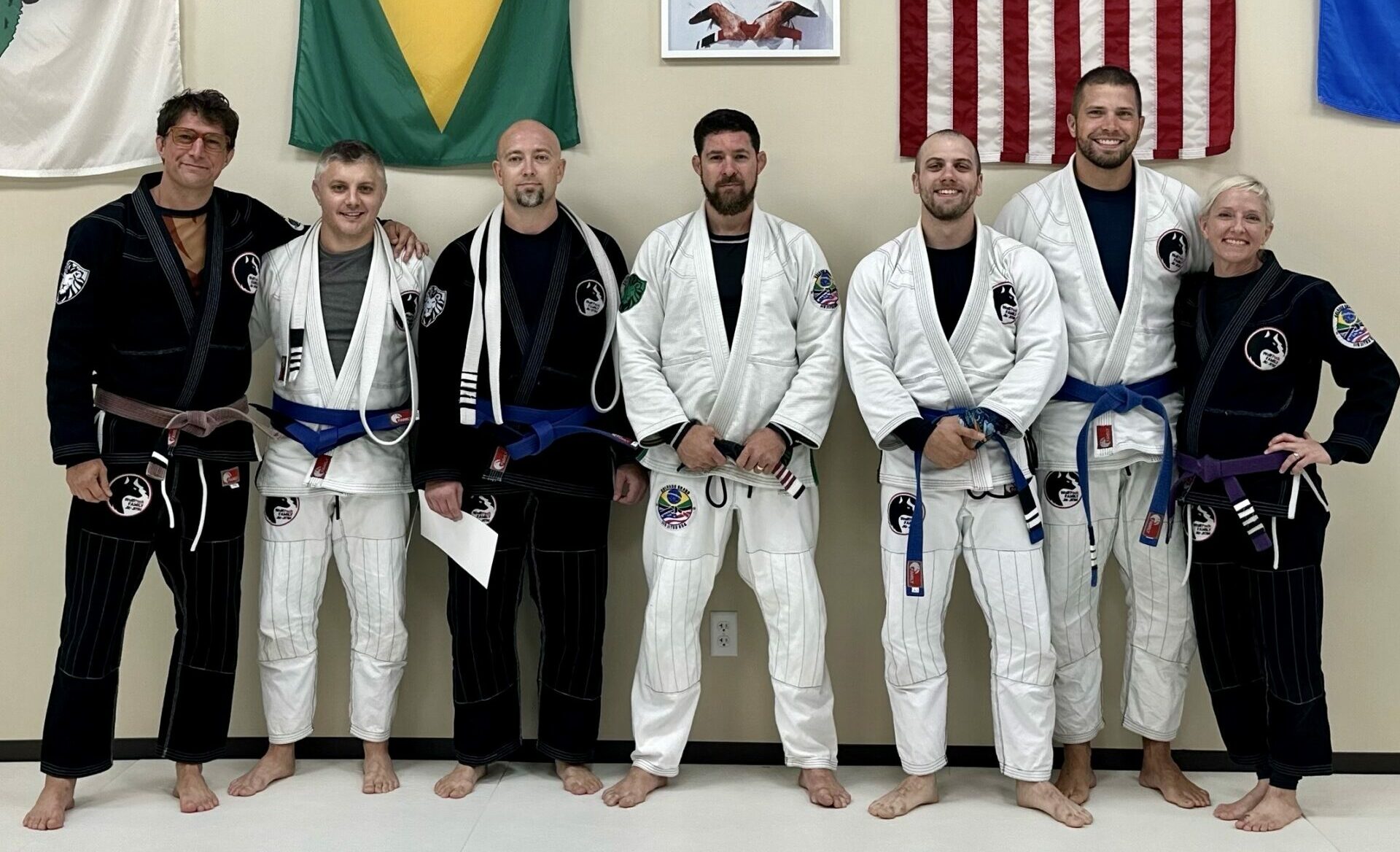 Four Aberdeen police officers were among those honored with blue belts at a Wolfpack Family Jiu-Jitsu ceremony on Sept. 8. From left are Wolfpack Family Jiu-Jitsu coach Joshua Citrak; officer Mark Miller, blue belt; officer Michael Bunke, blue belt; Matheus Colhado, a black belt who presented the belts; officer Zach Krage, blue belt second-degree; officer Kyle Fadness, blue-belt third degree, and Wolfpack Family Jiu-Jitsu coach Susan Citrak. Courtesy photo