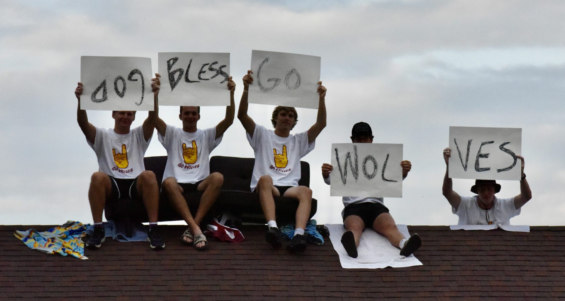 Some Northern State University fans found a unique vantage point for the Wolves football game against Minnesota-Duluth on Saturday, Sept. 9. They sat on top of the roof of a home across the street from Dacotah Bank Stadium. Aberdeen Insider photo by Scott Waltman