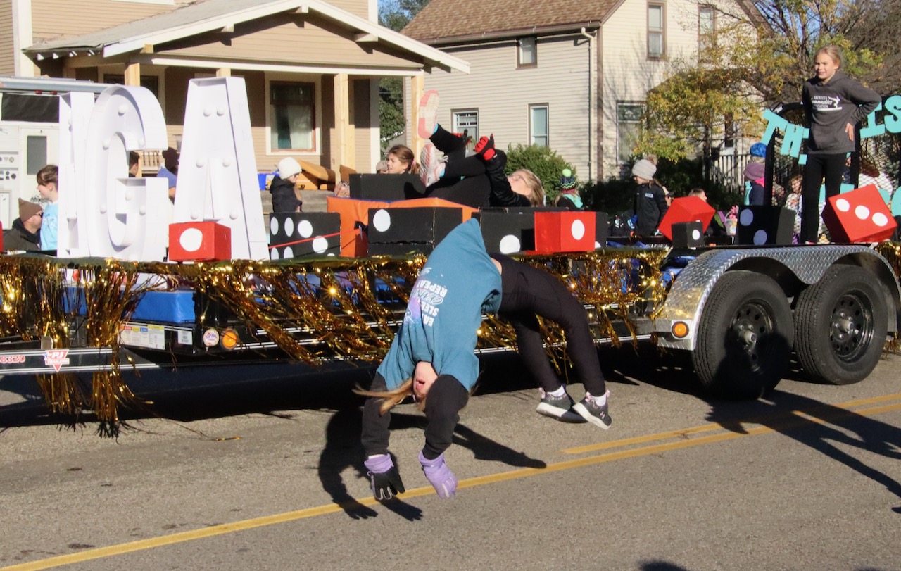 Aberdeen Gymnastics Association members did a variety of flips along the Northern State homecoming parade route on Saturday, Oct. 7. Aberdeen Insider photo by Elisa Sand