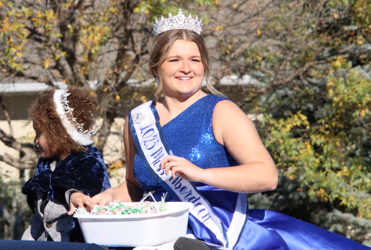 Summer Ryan, 2023 Miss Aberdeen, tosses out candy during the homecoming parade for Northern State on Saturday, Oct. 7. Aberdeen Insider photo by Elisa Sand