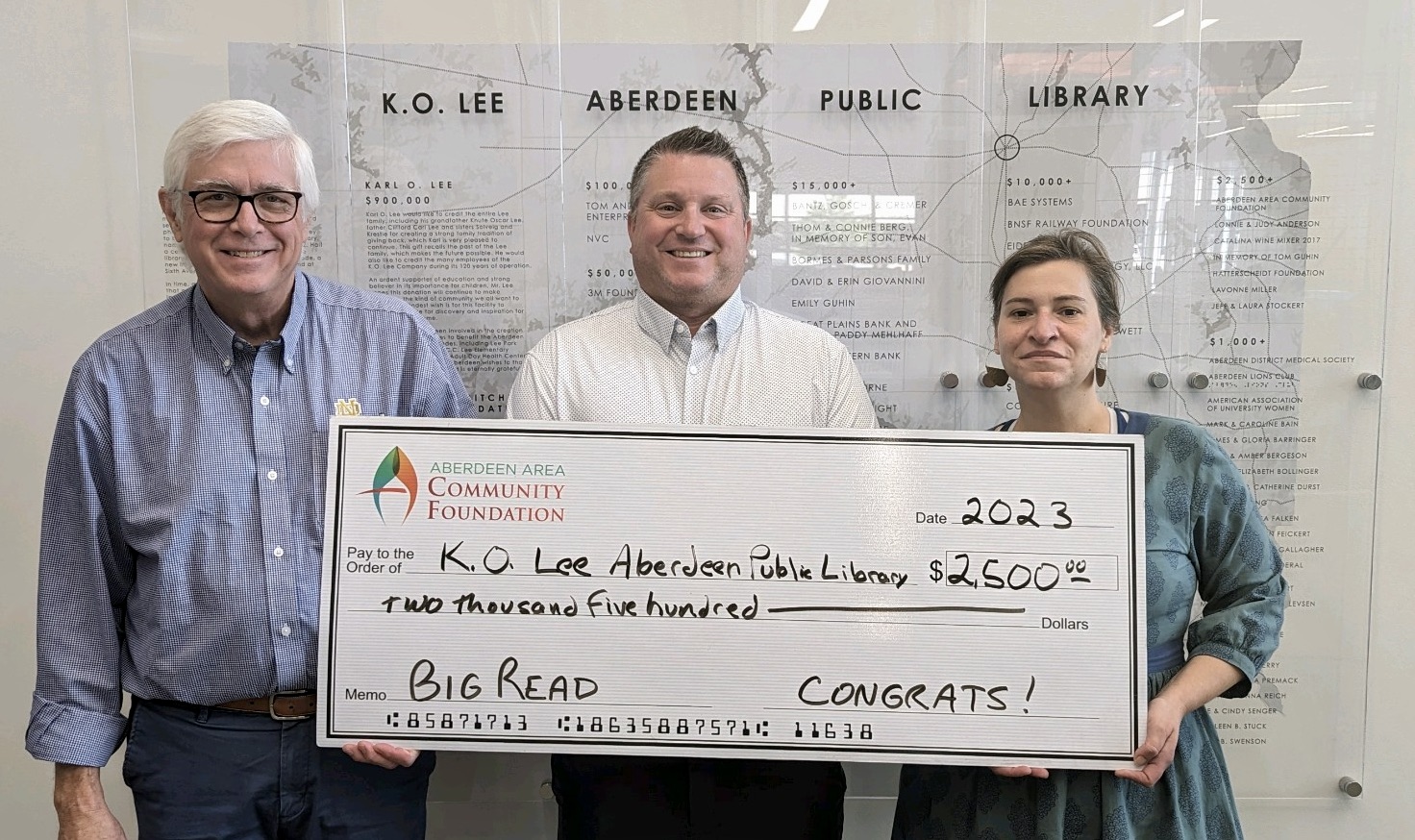 K.O. Lee Aberdeen Public Library received $2,500 to support its Big Read project, which will run from fall 2023 to spring 2024. Pictured, from left, are Patrick Gallagher, Aberdeen Area Community Foundation executive director; Heath Johnson, Aberdeen Area Community Foundation chairman; and Anna Moser, K.O. Lee Aberdeen Public Library director. Courtesy photo