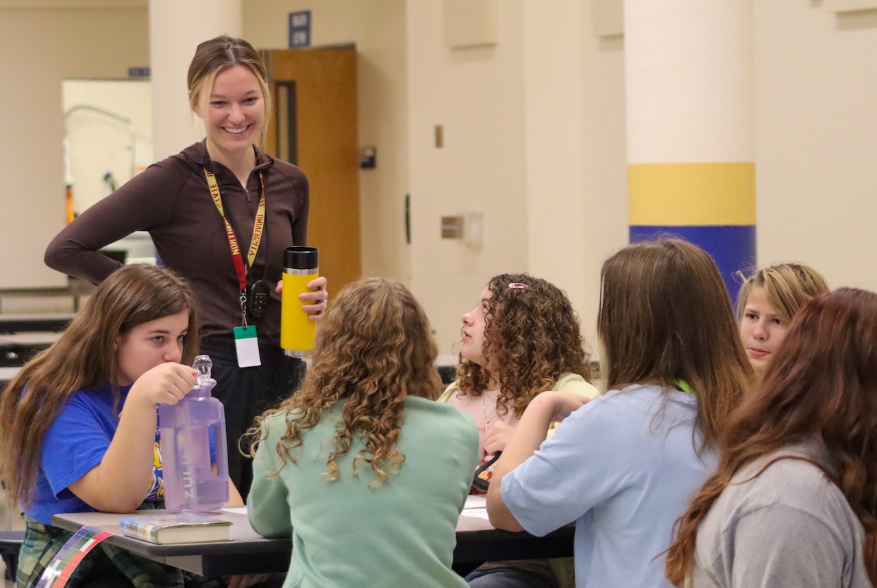 Cassidy Neer, FOR Club advisor at Simmons middle School, visits with FOR Club members. Photo courtesy of the Aberdeen Public School District