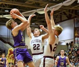 Sully Buttes' Wes Wittler takes a jump shot over Freeman's Luke Peters (22), and Luke Miller during their Class B Boys State Tournament quarterfinal Thursday, March 19 inside the Barnett Center. Wittler scored 28 points in a 63-55 loss. Photo by Kevin Foss for the Aberdeen Insider.
